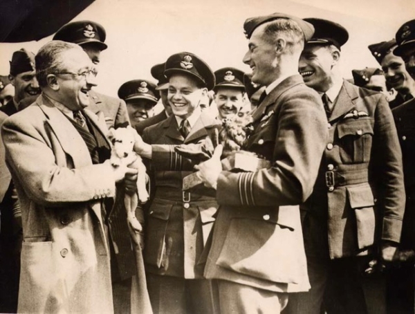 Presentation of the Lion - May 1943 by Mr. Echkman, from MGM Fim Co. presenting a bronze lion to W/C Burnside